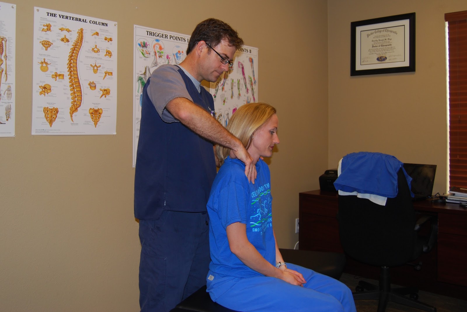 Chiropractor adjusting a patient